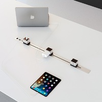 Table de conférence électrique réglable en hauteur avec prises modulaires intégrées, disponible en plusieurs couleurs, idéale pour les salles de réunion