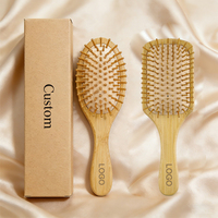 Brosse à cheveux en bambou écologique naturelle démêlante avec logo personnalisé et manche massant
