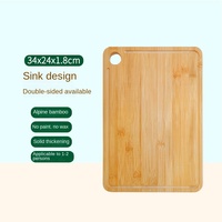 Planche à découper rectangulaire en bambou écologique avec trou de suspension et rainure de drainage inclinée pour la préparation des aliments en cuisine