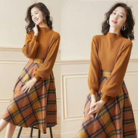Ensemble deux-pièces en tricot côtelé à manches longues, avec jupe à carreaux en diamant, style européen hivernal et mode.