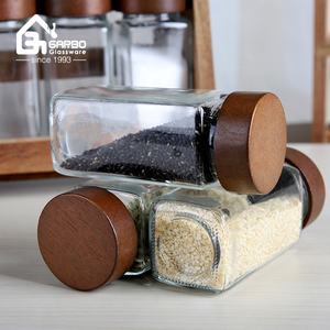 9 pz set <span class=keywords><strong>di</strong></span> bottiglie <span class=keywords><strong>di</strong></span> condimento <span class=keywords><strong>con</strong></span> Stand <span class=keywords><strong>di</strong></span> forma quadrata bottiglia <span class=keywords><strong>di</strong></span> <span class=keywords><strong>vetro</strong></span> <span class=keywords><strong>con</strong></span> <span class=keywords><strong>coperchio</strong></span> in legno vendita calda nel mercato Algeria fornitore della cina - Product Image 4