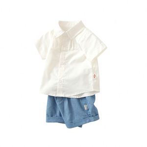 Ensemble de vêtements pour bébé 100% coton de haute qualité petit t-shirt court et short avec logo blanc pour garçons - Product Image 1
