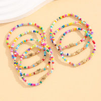 Lot de 7 Bracelets Élastiques Faits Main en Verre Soufflé Style Bohème avec Perles Multicolores et Breloques Cœur Dorées