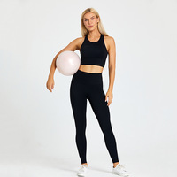 Logo personnalisé Ensemble de sport de yoga pour femmes Haut de soutien-gorge de sport antibactérien de couleur unie et leggings taille haute sans couture pour l'entraînement et le soulèvement des fesses