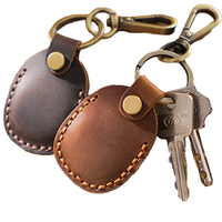 Porte-clés portable personnalisé avec pochette à monnaie en cuir véritable à la mode Tracker Cover Car Hanging Mini Storage Keychain