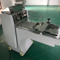 Machine à mouler la pâte à pain électrique automatique Ligne de production roulante pour boulangerie Utilisation en restaurant Nouvelle condition Farine Oeuf Ingrédients