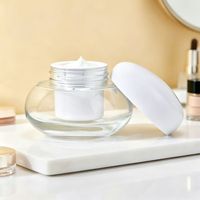 Pot cosmétique de luxe unique en verre transparent de 50g avec revêtement intérieur anti-fuite pour crème visage, beurre corporel et emballage cosmétique