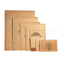 Enveloppe en papier kraft rembourrée en nid d'abeille compostable personnalisée 100% pour enveloppe express en nid d'abeille pour l'expédition
