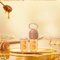 Huile à lèvres hydratante brillante à l'extrait de miel, personnalisable OEM/ODM, avec boucle de suspension, pour maquillage de beauté