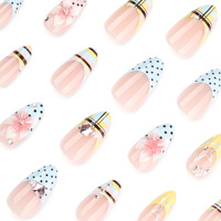 Vente en gros de faux ongles en acrylique de style français en forme d'amande |   Ongles personnalisables aux couleurs pastel avec motifs à pois, étoiles et fleurs