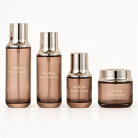 Stock disponible |   Série d'emballages de soins de la peau en verre givré gris fumé de qualité supérieure, flacon luxueux à texture raffinée