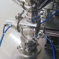 Machine de remplissage pneumatique verticale semi-automatique à buse unique Henwi, pour le remplissage de liquides dans l'industrie cosmétique, alimentaire et chimique