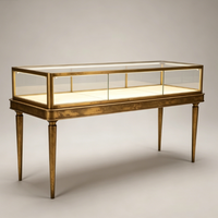 Vitrine de présentation de bijoux en métal doré antique avec pieds, comptoir en verre éclairé pour boutique de joaillerie haut de gamme