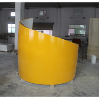 Comptoir de réception personnalisé multifonctionnel en pierre de surface solide jaune, design cylindrique, avec logo