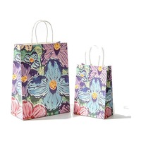 Sac cadeau en papier imprimé floral avec logo personnalisé et poignée en papier torsadé pour emballage de cosmétiques et de parfums, vente en gros