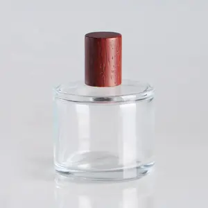 30 मिलीलीटर 50 मिलीलीटर 100 मिलीलीटर गोल कांच की बोतल बॉक्स और लकड़ी की टोपी के साथ लक्जरी इत्र का निर्माण करती है