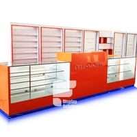 Vitrine de présentation de téléphones portables haut de gamme pour la vente au détail, comptoir de magasin de téléphonie mobile en MDF + alliage de titane + verre trempé, taille et couleur personnalisées
