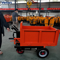 Chariot à plateforme à trois roues alimenté par batterie avec structure en acier pour les chantiers de construction, équipement de manutention de matériaux