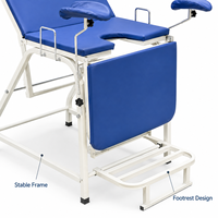 Table d'examen gynécologique avec cadre en acier inoxydable et support de jambe réglable pour usage hospitalier et clinique
