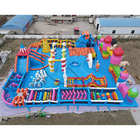 Grand parc aquatique gonflable en forme d'éléphant avec entrée double éléphant et parcours d'obstacles interactif pour les centres de divertissement aquatique