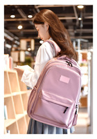 Sac à dos en polyester au design unique pour les élèves du collège, style tendance, disponible en rose, noir, blanc, bleu et gris