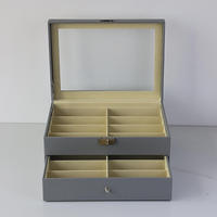 Boîte de rangement de luxe moderne Jamey pour lunettes de soleil, 18 compartiments, couvercle transparent, verrouillable, présentoir multi-grilles pour bijoux et montres, haute qualité