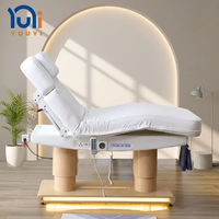 Lit de beauté électrique blanc à 4 moteurs, chauffant et réglable, pour soins du visage et massage, avec base dorée LED pour salon