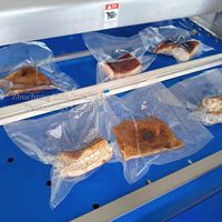 Machine d'emballage sous vide continu pour poitrines de poulet, scelleuse sous vide pour volailles, équipement d'emballage sous vide, machine à sceller les sacs sous vide