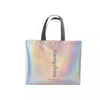 Sacs de shopping non-tissés portables à bandoulière longue avec imprimés animaux laser pour emballage de vêtements féminins stylés