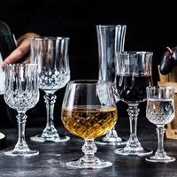 Vente en gros de verres à vin en cristal ultra-fins de luxe personnalisés avec tige rouge et base noire pour cadeaux, ensemble de verres à vin cylindriques à longue tige pour mariage