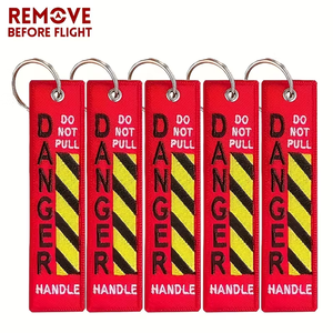 5 unidades/bolsa Llaveros con bordado 'NO TIRAR, PUNTO DE RIESGO' para coche, motocicleta, equipaje, llaves, accesorios y regalo - Product Image 1