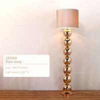 Lampe sur pied LED de style industriel nordique avec base en métal empilée et abat-jour en tissu doux pour maison d'hôtes, café, bureau