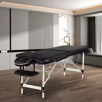 Nouvelle arrivée, lit de spa populaire, table de massage pliable portable noire, table de massage en aluminium, table de massage de salon
