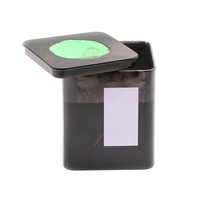 Lata de hierro de hojalata cuadrada negra con ventana circular verde para almacenar café y pequeño, lo que permite una fácil vista del contenido