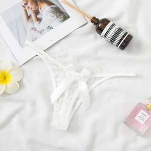 Vente directe d'usine de lingerie sexy en dentelle ajourée, tangas transparents très sexy, culottes taille basse à nœud papillon pour femmes. - Product Image 2