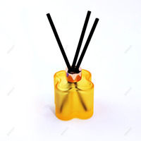 Vente en gros ensemble moderne et populaire de diffuseur de parfum à roseaux en forme de fleur bouteille de diffuseur de parfum d'huile en verre de luxe floral avec bâtonnets de rotin