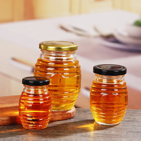 Pot de miel de bouteille en verre en gros pour le stockage des aliments pot en nid d'abeille 120g 250g 500g 1000g avec couvercle