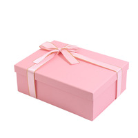 Boîte en carton de luxe haut de gamme personnalisée avec logo magnétique en forme de livre pour emballage cadeau avec ruban et doublure en éponge pour nettoyant visage