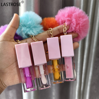Prix d'usine Huile à lèvres Pom Key Chain, gloss hydratant pour enfants, avec pompon en fourrure mignon, saveur fruitée, 45 couleurs