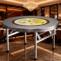 Runder Esstisch aus Edelstahl im neuen Stil mit Plattenspieler zum Essen im Hotel restaurant