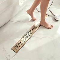 PVD Gebürsteter Goldener Linearer Duschablauf aus 304 Edelstahl mit Magnetischem Geruchsstopper und Hochdurchflusskanal für den Außenbereich