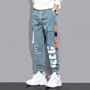 Wholesale Men <b>Tape</b> Loose <b>Binding</b> Pants Casual Trousers Punching Pants Patchwork Loose Cargo Pants Fashion Style - Product Image 1