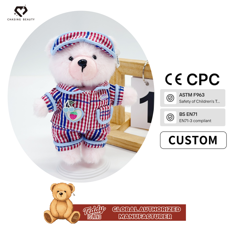 Ours en peluche pyjama à carreaux rouge, blanc et bleu
