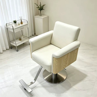 Nouvelle chaise de barbier ergonomique en cuir avec pompe hydraulique rotative et repose-pieds réglable pour salons de coiffure - Direct Usine