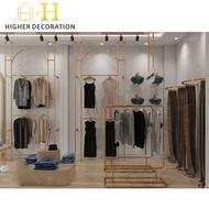 Vitrine de magasin de vêtements moderne, présentoir de vêtements en métal de luxe, présentoir de vêtements personnalisé, mobilier de magasin de vêtements durable