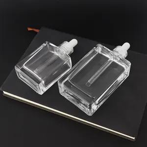 Botol tetes kaca bening dalam bentuk persegi botol kaca tebal untuk kapasitas pencetakan berbagai kapasitas