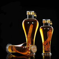 Bouteille de vin à bulles de ginseng transparente en verre borosilicate de luxe de 1000 ml avec des verrous et des couvercles métalliques pour boîte cadeau
