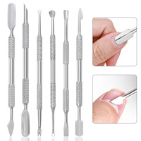 Pousse-cuticules double face en acier inoxydable de haute qualité, durable et réutilisable, pour le retrait du vernis gel et des ongles.