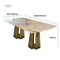 Table élégante avec dessus en marbre et base en cuivre antique en acier inoxydable brossé