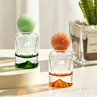 Flacon de parfum en verre vide cylindrique de 50 ml avec bouchon rond et col serti, personnalisable, vente en gros par Anding Supplier